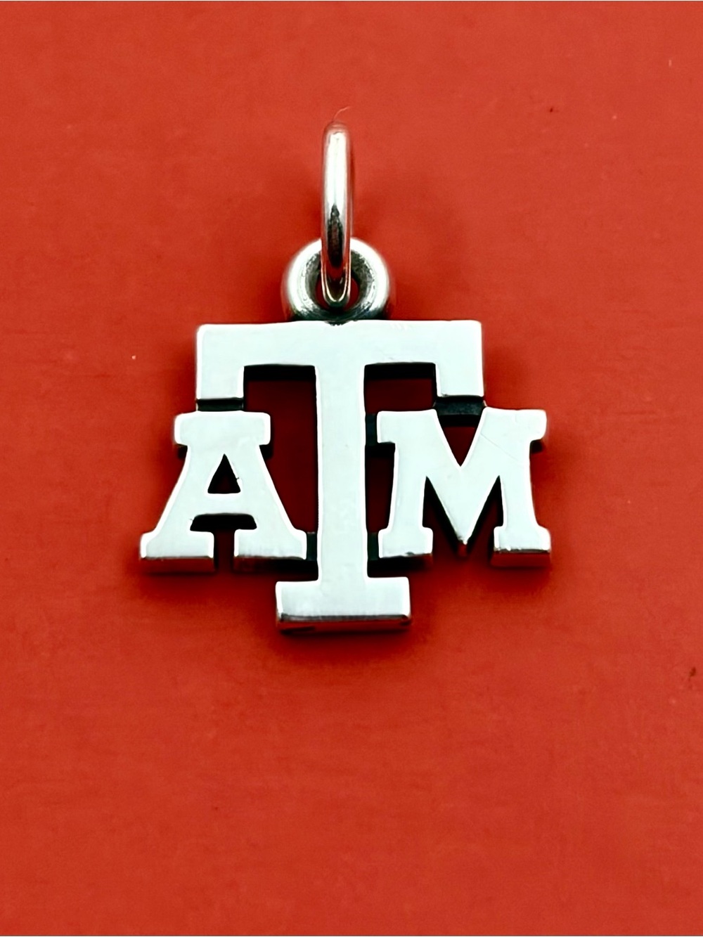 James Avery Silver 'ATM' Logo Charm on Red